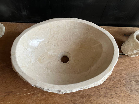Natural beige marble bathroom vessel sink BMS-008 showing its rough chiseled exterior