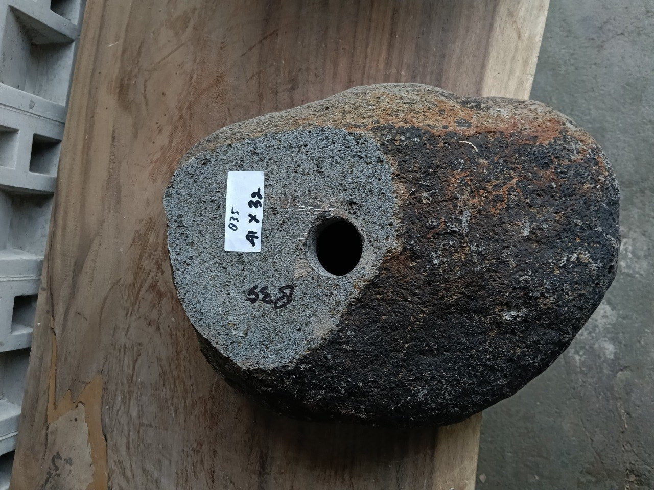 Bottom view of 6835-4132 solid river rock sink, carved from one piece