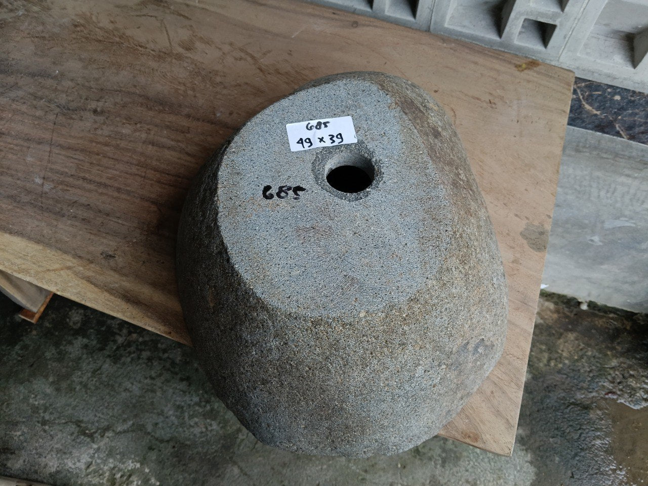 Bottom view of 6685-4939 solid river stone sink — standard drain hole