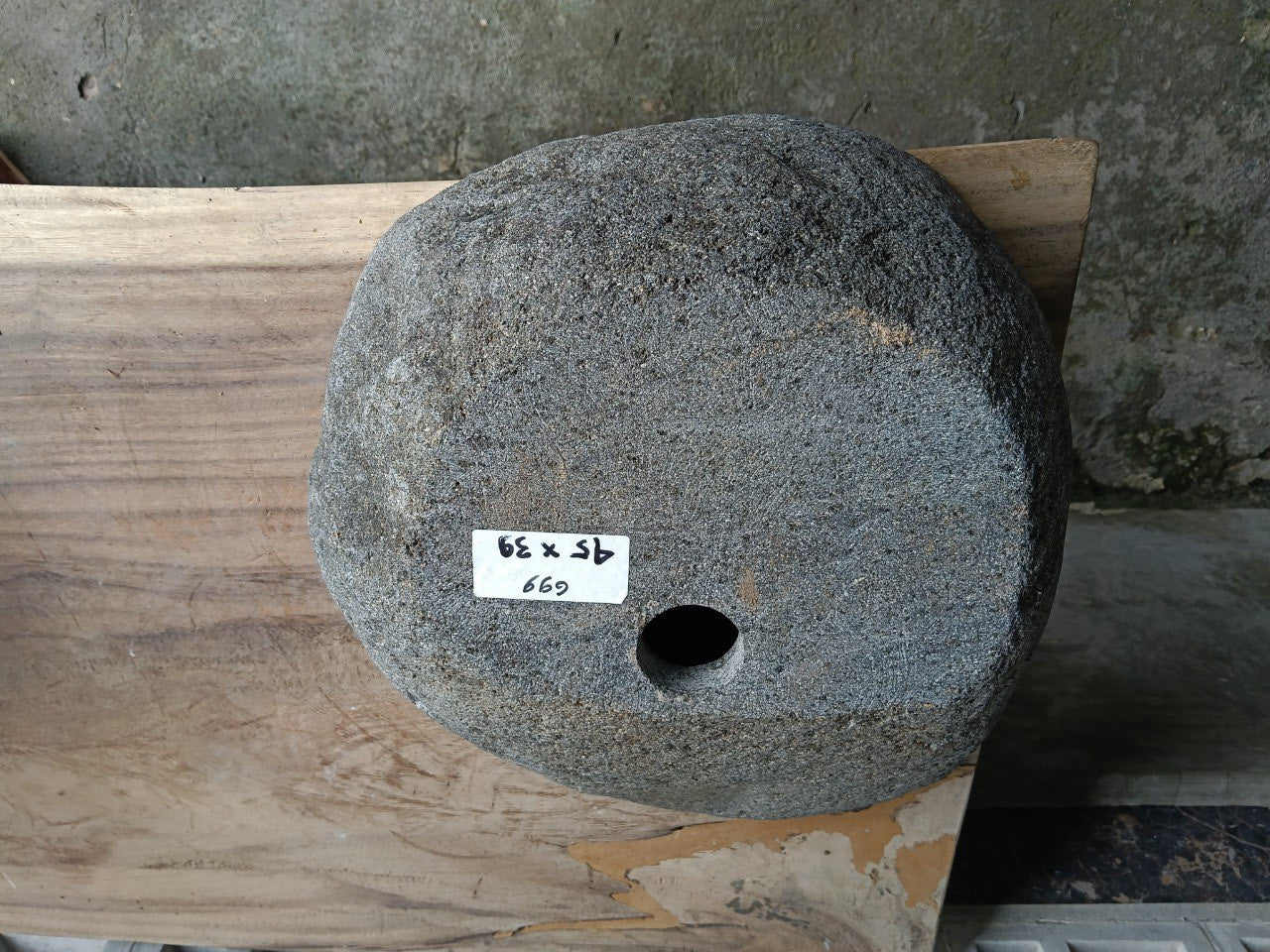 Bottom view of 6699-4539 solid river stone sink — standard drain hole