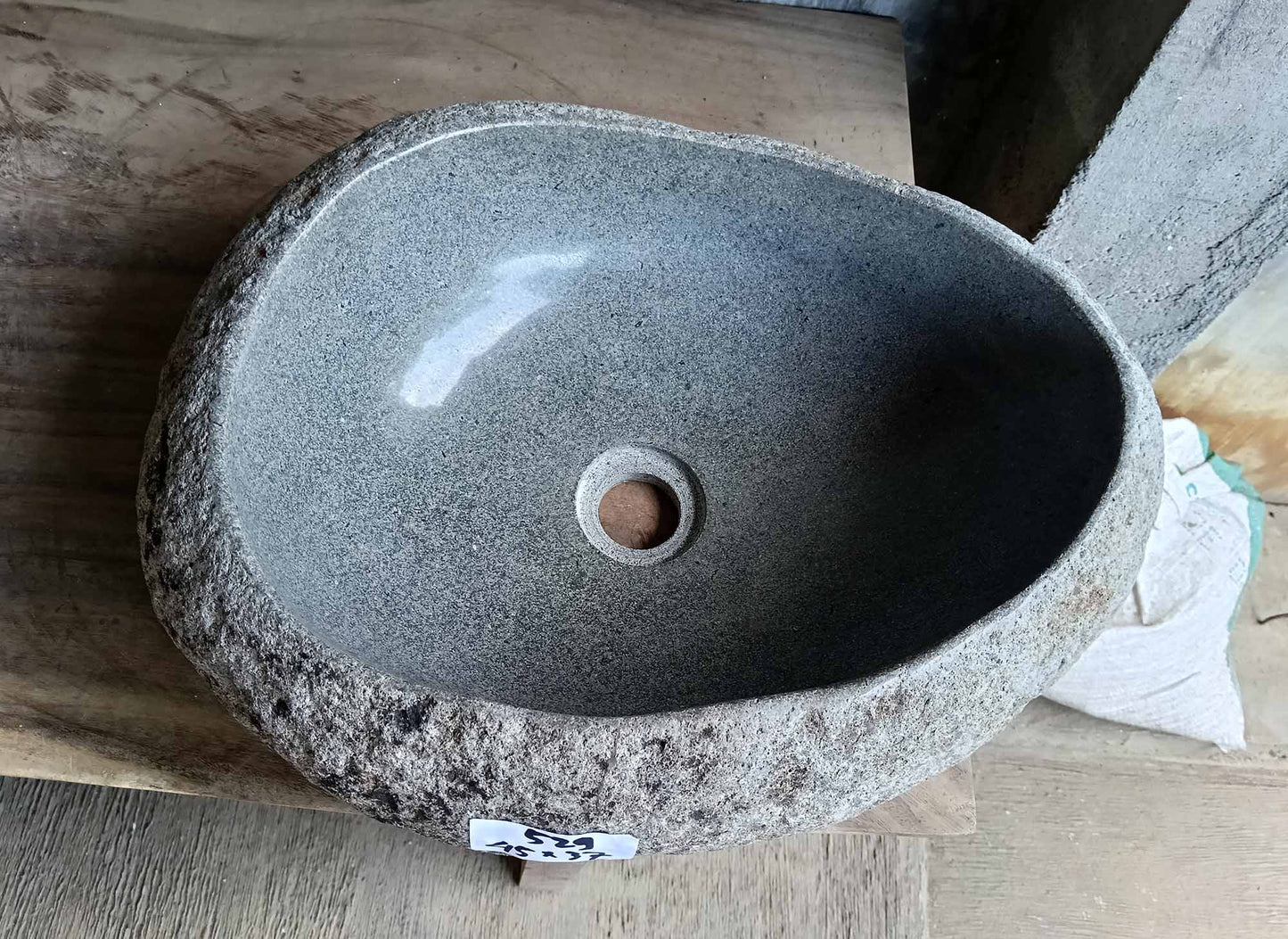 Top view of river stone sink with light gray polished interior and asymmetrical oval shape – SKU 6529-1815