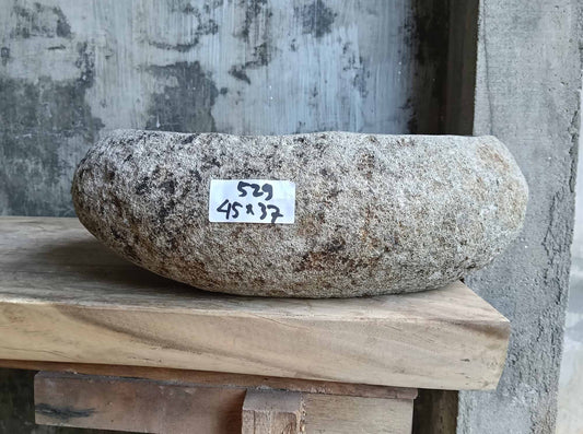 Front view of handcrafted river stone sink with raw textured surface and speckled stone color – SKU 6529-1815