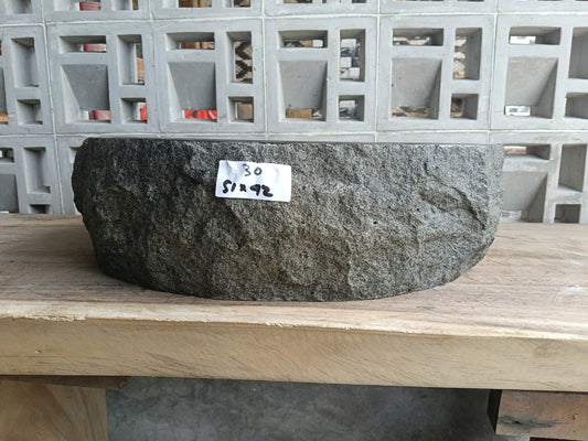 Front view of handcrafted oval light gray andesite bathroom sink