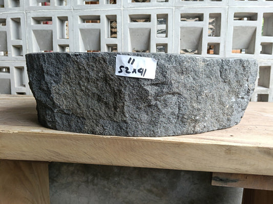 Front view of handcrafted asymmetrical oval andesite bathroom sink