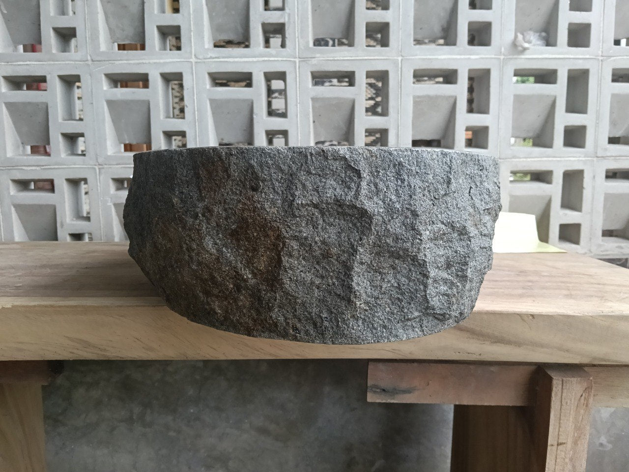 Right side view of handcrafted dark gray oval andesite sink
