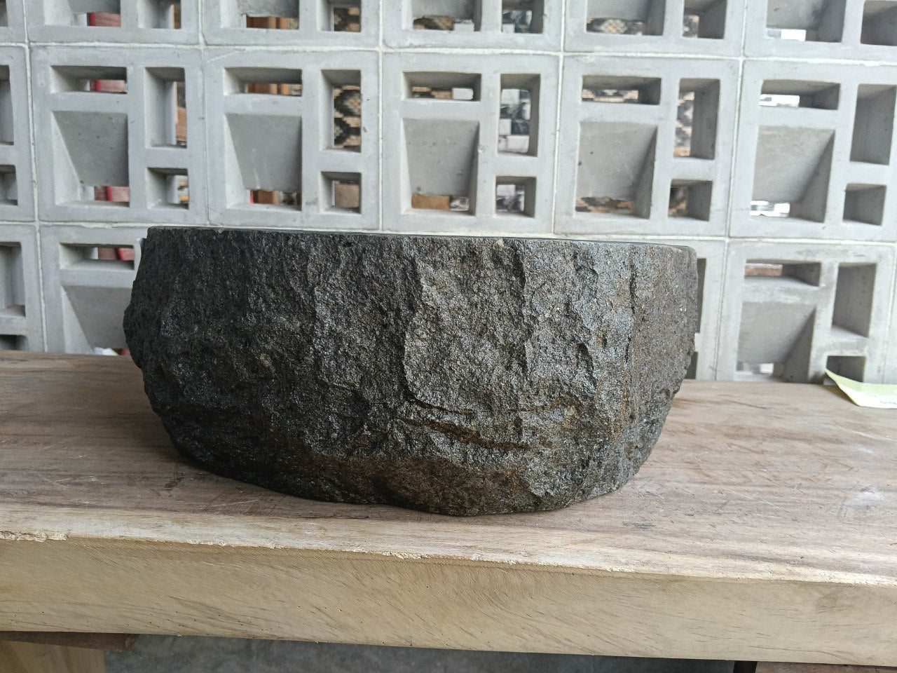 Back view showing split-rock exterior of andesite stone sink