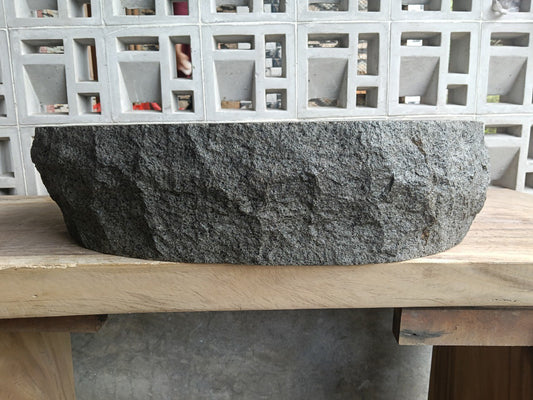 Front view of handcrafted elongated oval andesite bathroom sink
