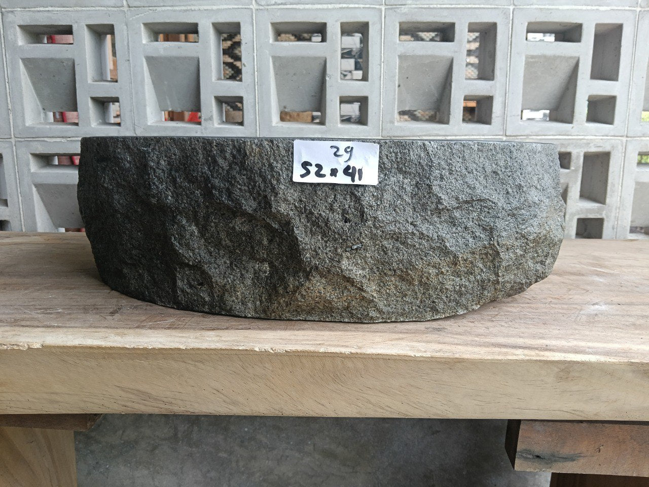 Front view of handcrafted oval andesite bathroom sink with natural veining