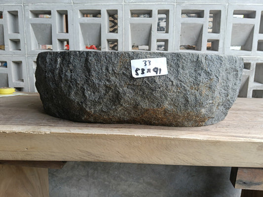 Front view of handcrafted oval light gray andesite bathroom sink