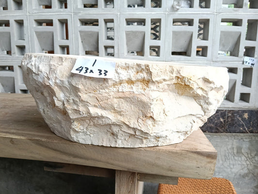 Front view of handcrafted oval beige marble bathroom sink