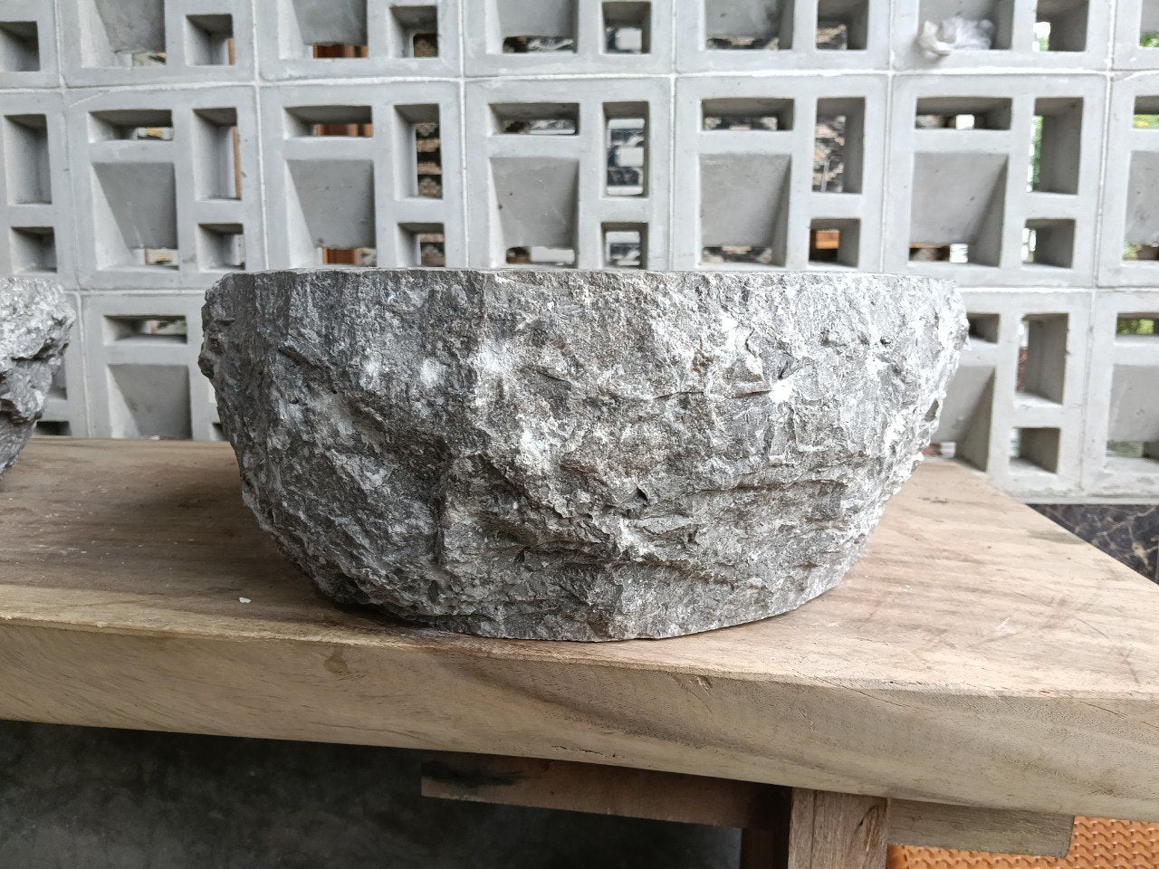 Back view showing split-rock exterior of gray marble sink