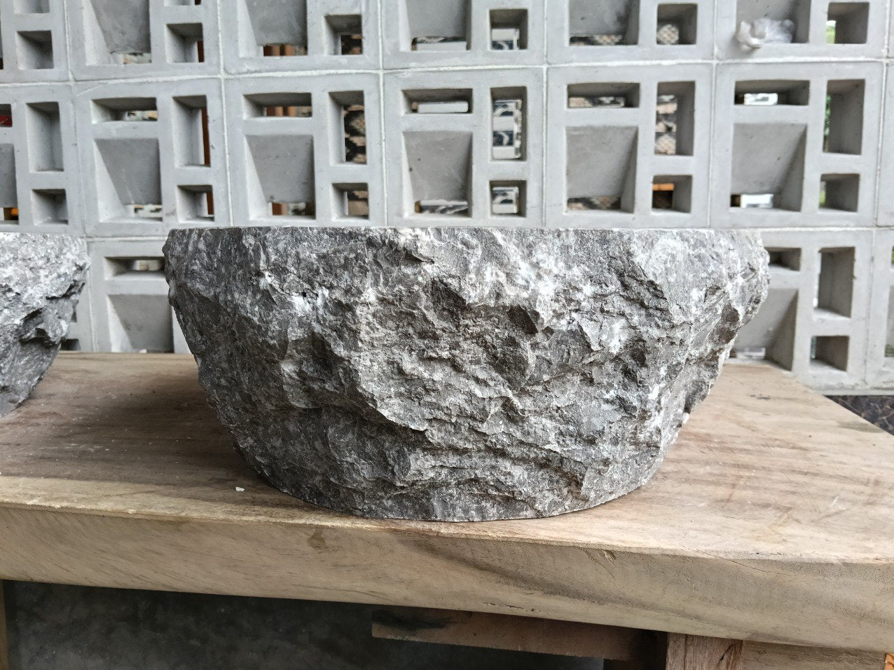 Right side perspective of handcrafted gray marble stone sink