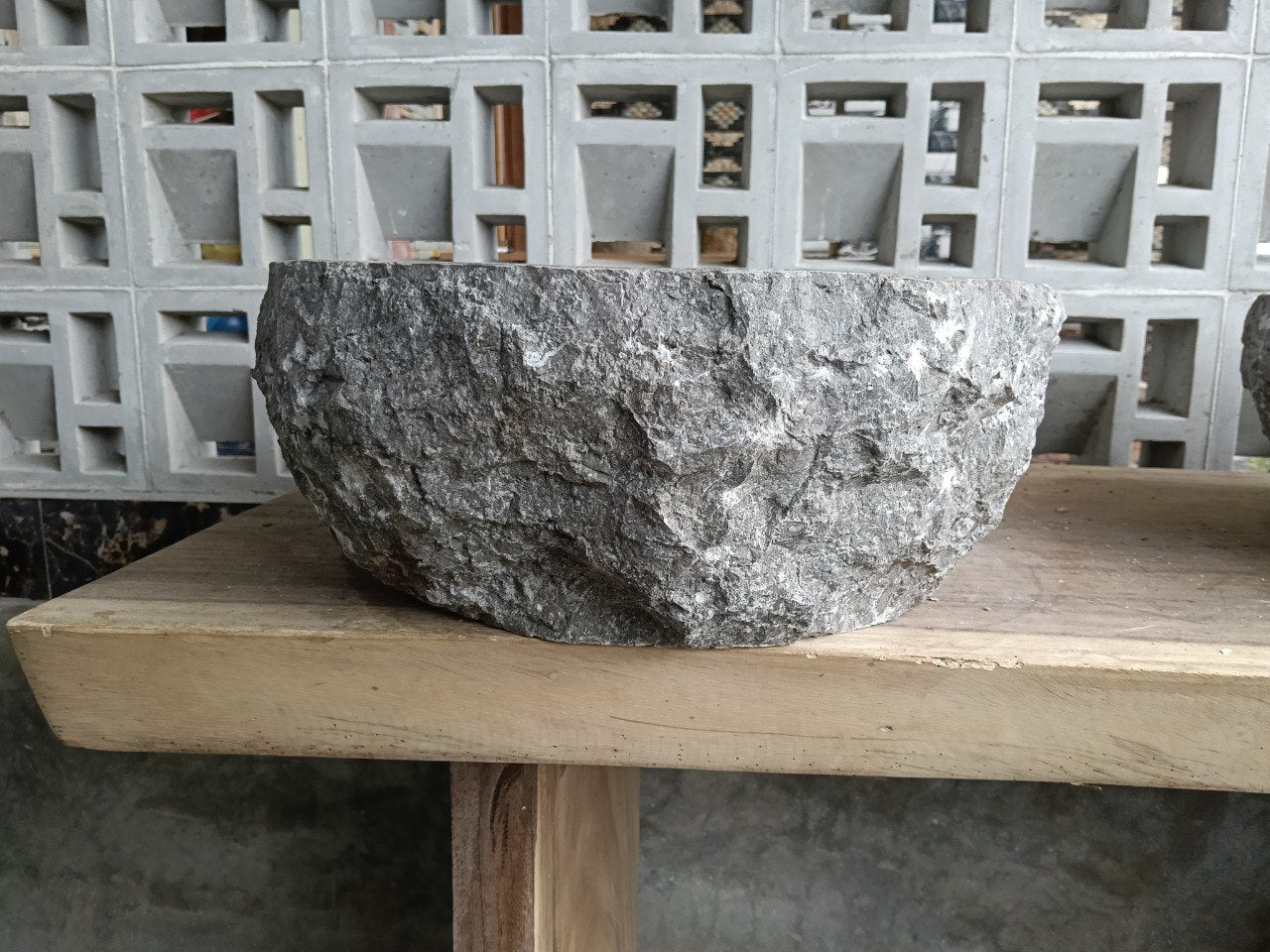 Back view showing natural split-rock exterior of gray marble sink