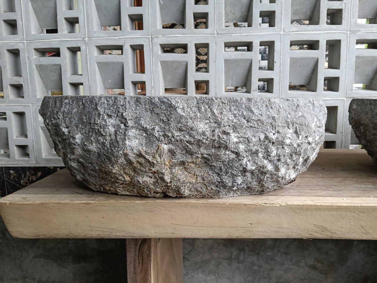 Left side perspective of oval polished gray marble basin