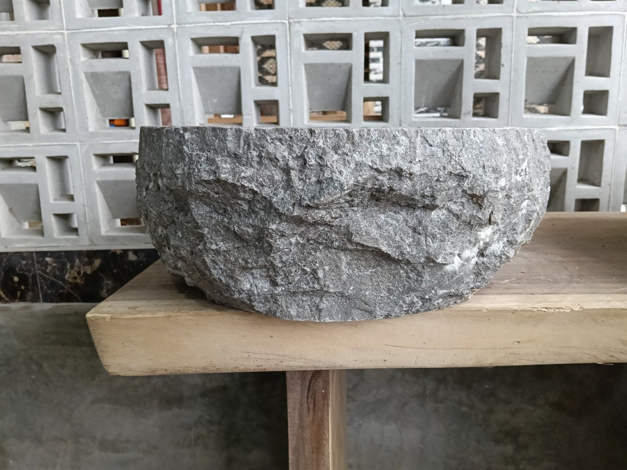 Right side perspective of handcrafted gray marble stone sink