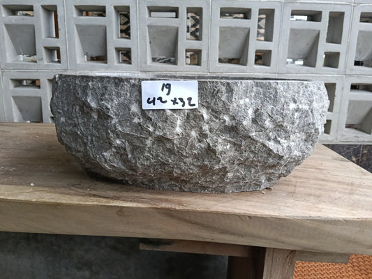 Front view of handcrafted oval gray marble bathroom sink