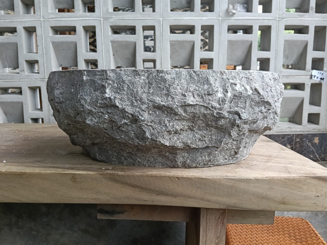 Back view showing natural split-rock exterior of gray marble sink