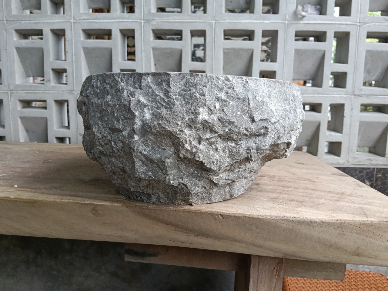 Right side perspective of handcrafted gray marble stone sink