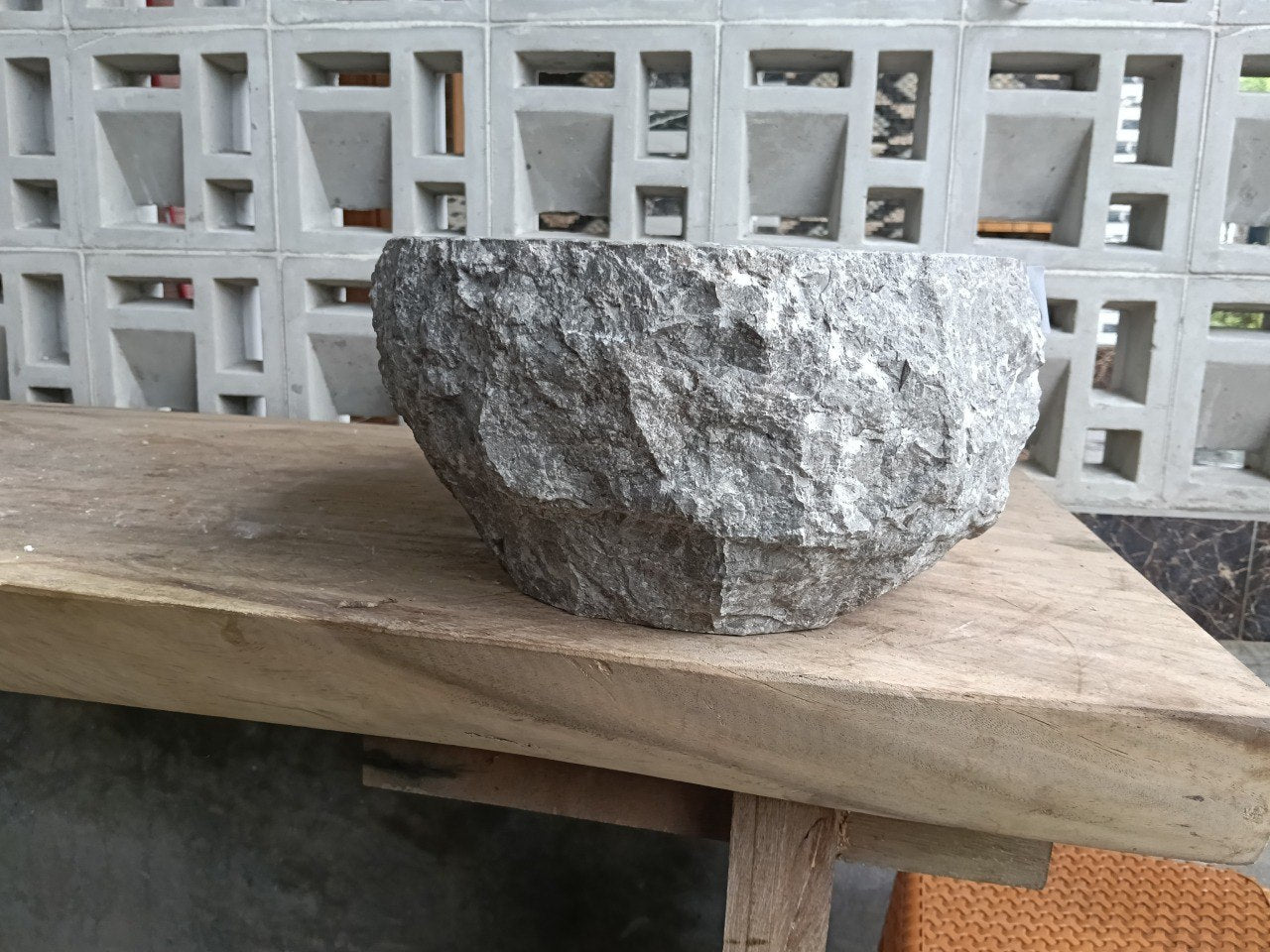 Left side perspective of oval polished gray marble basin