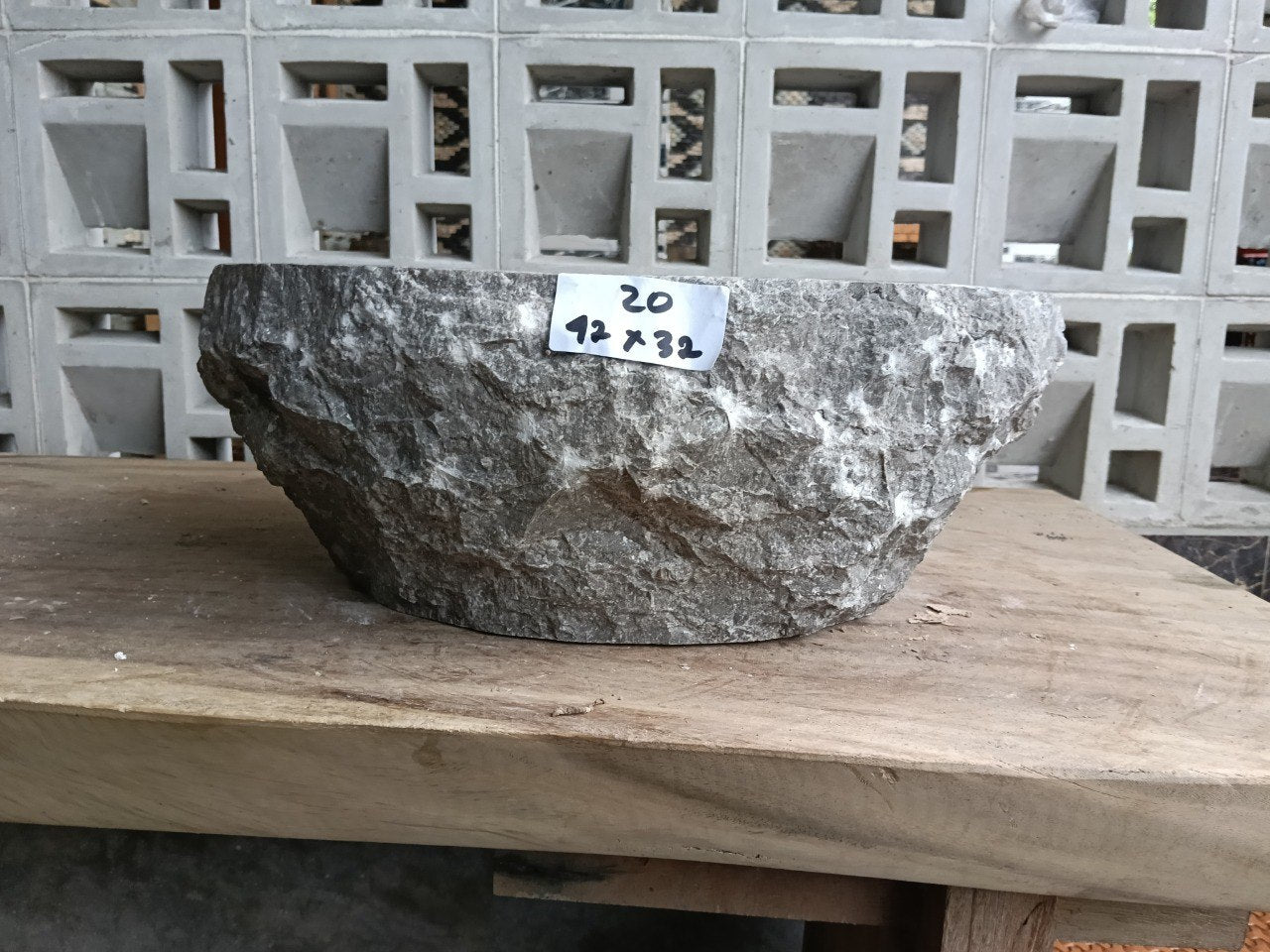 Front view of handcrafted gray marble bathroom sink