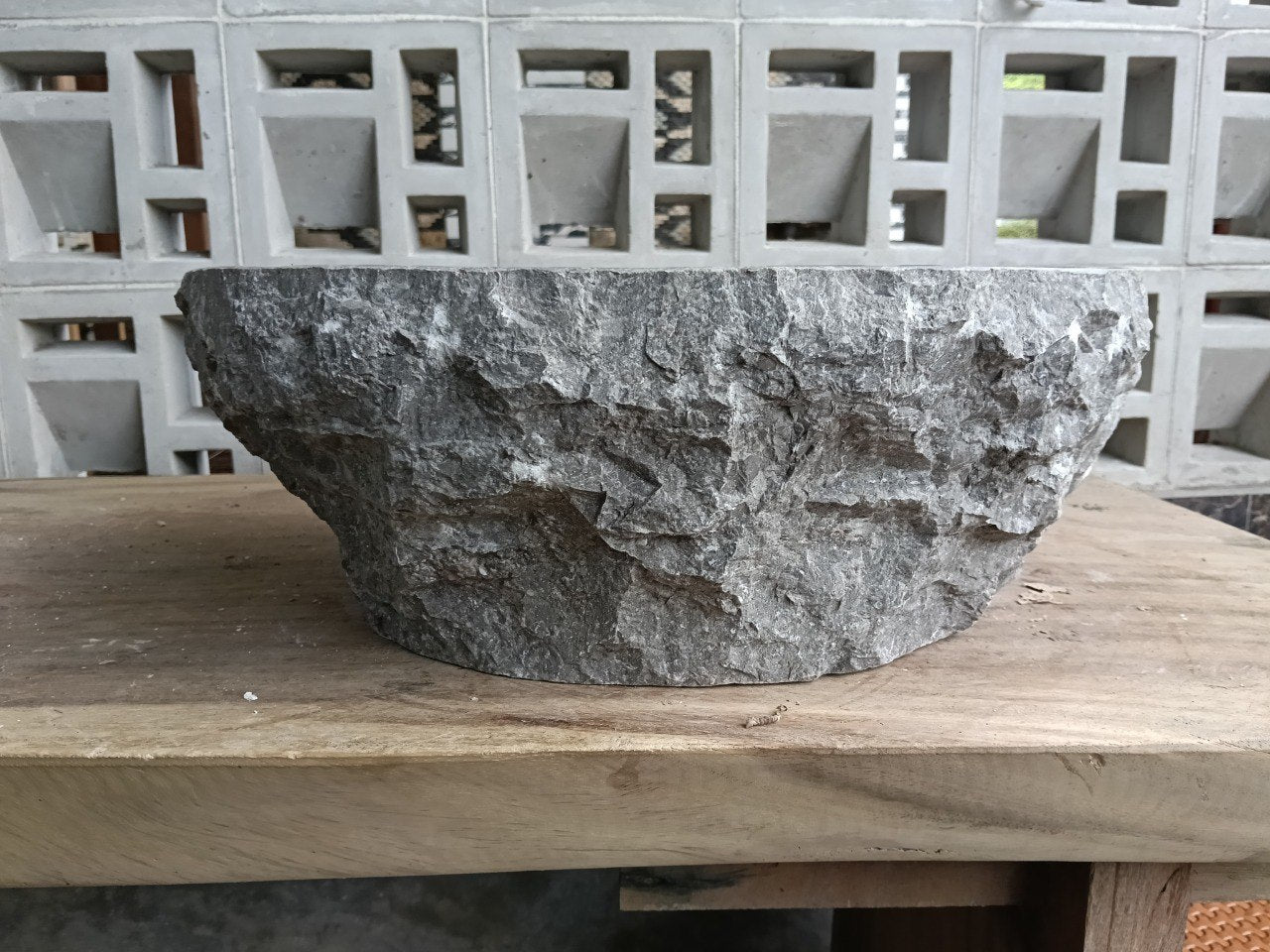 Left side perspective of polished oval gray marble basin