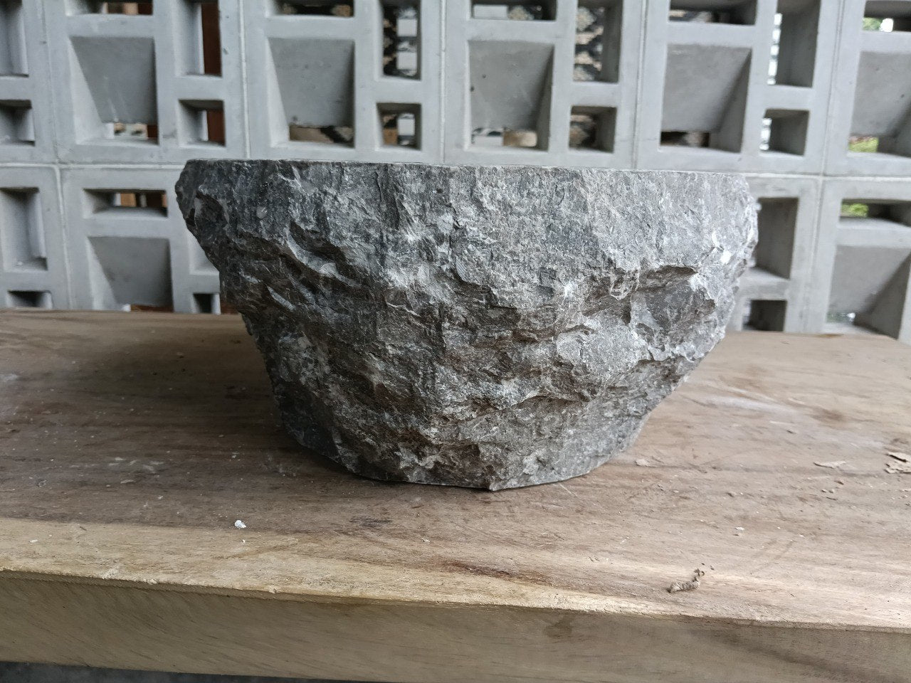 Right side perspective of handcrafted oval gray marble sink