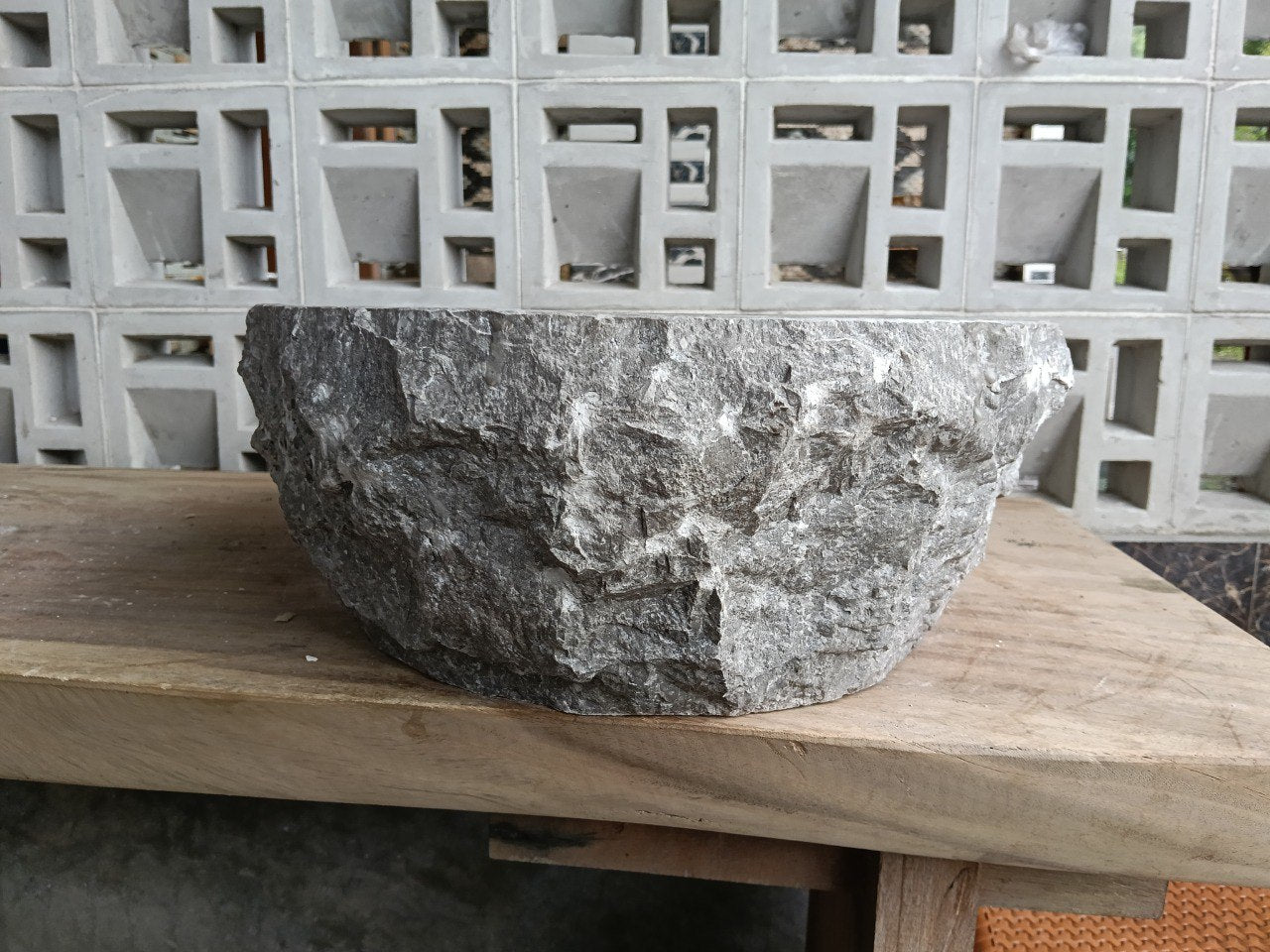 Back view showing split-rock texture of gray marble sink