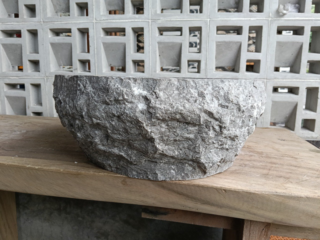 Left side angle of oval gray marble stone basin