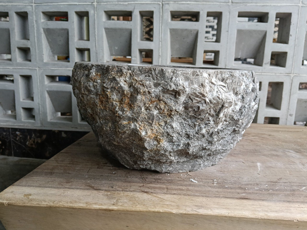 Back side showing rough split-rock marble texture