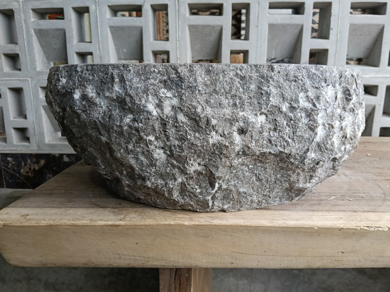 Left side profile of oval gray marble sink