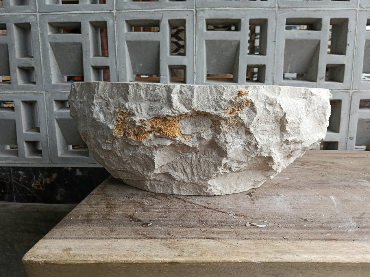Right side view of polished beige marble sink