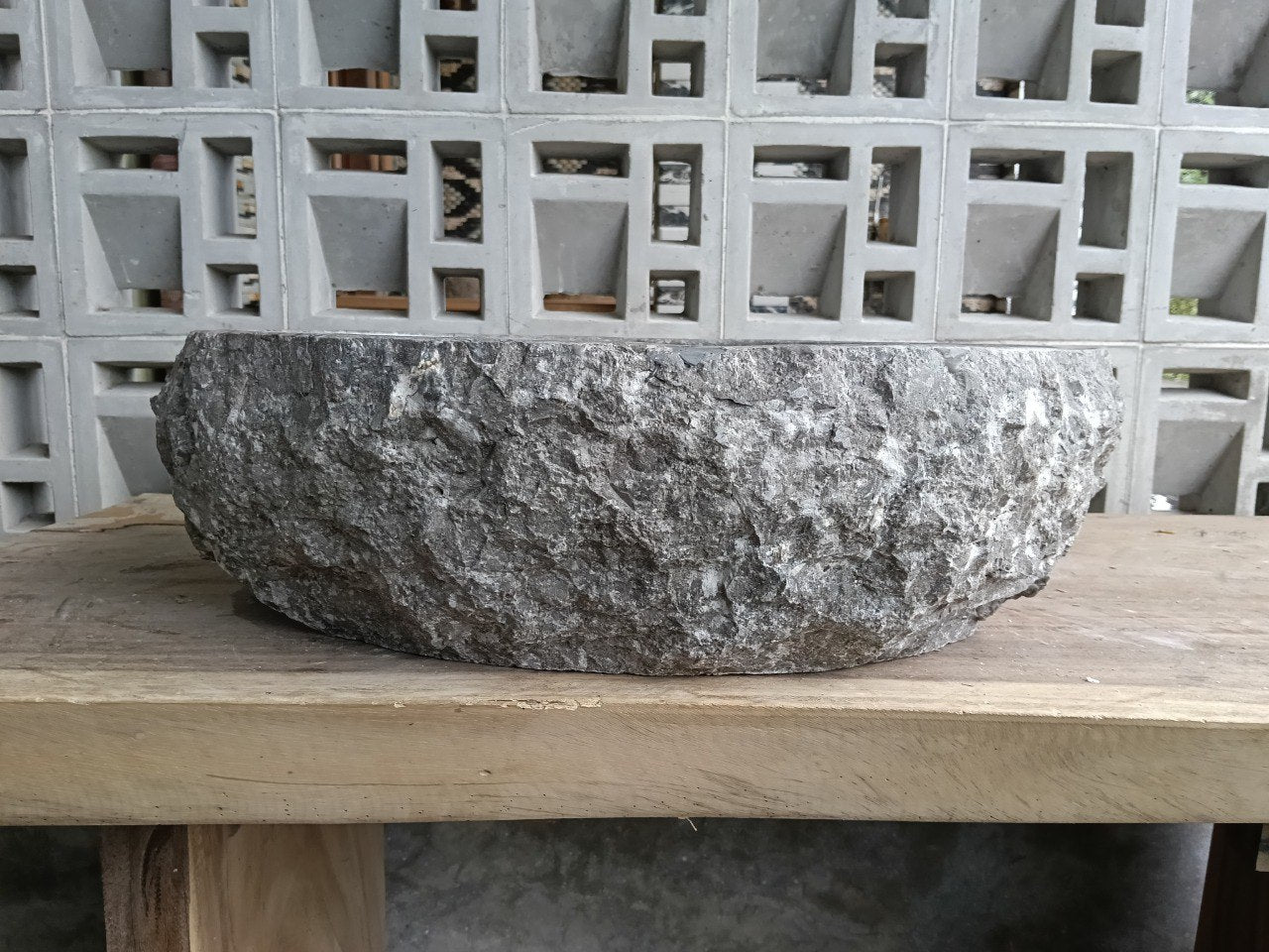 Left side profile showing raw marble texture