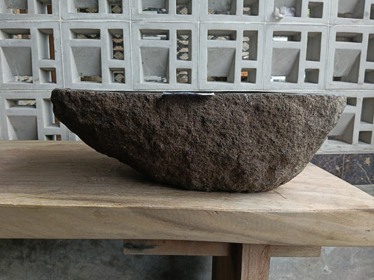 Front view of 6704-5138 river stone basin — polished interior