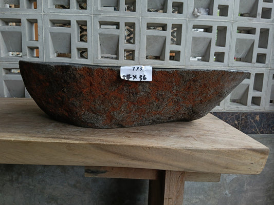 Front view of 6775-5736 river stone basin — polished interior