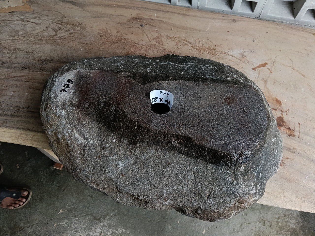 Bottom view of 6779-5844 solid river stone vessel