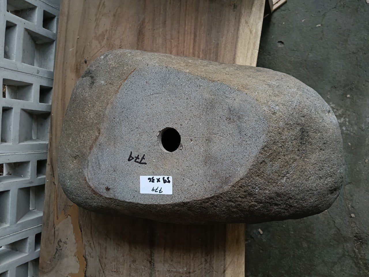 Bottom view of 6774-5936 solid river stone vessel
