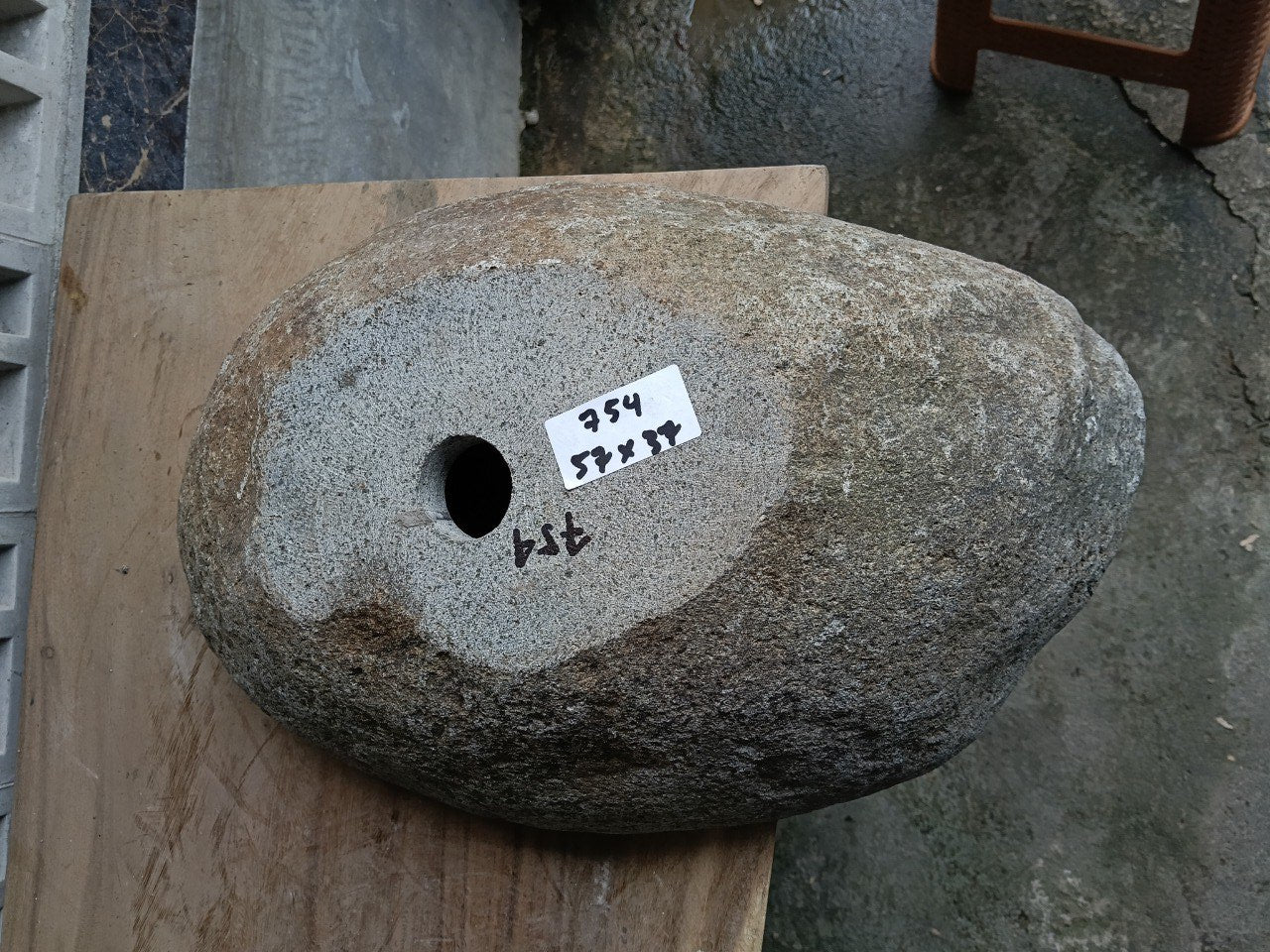 Bottom view of 6754-5737 solid river stone vessel