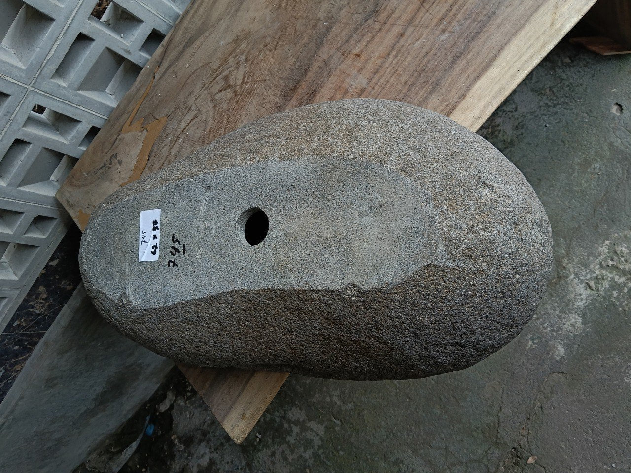 Bottom view of 6745-6237 solid river stone vessel