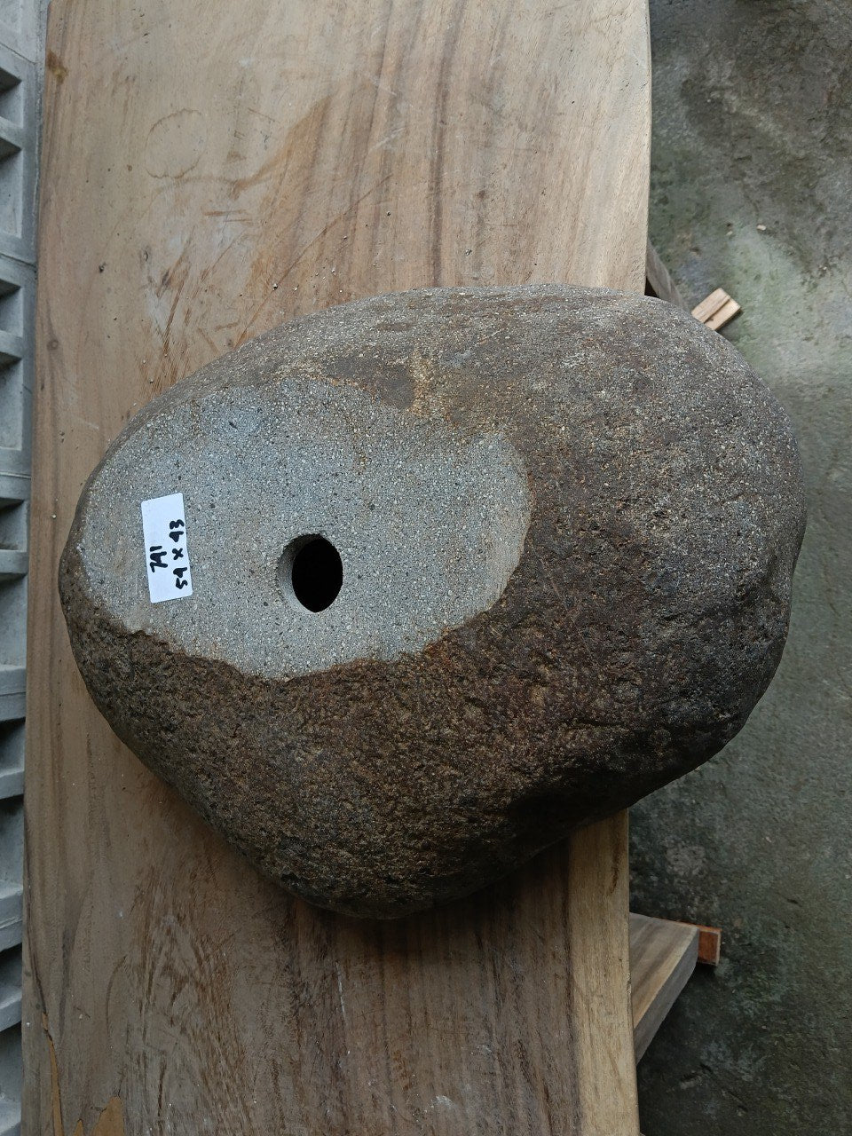 Bottom view of 6741-5443 solid river stone vessel
