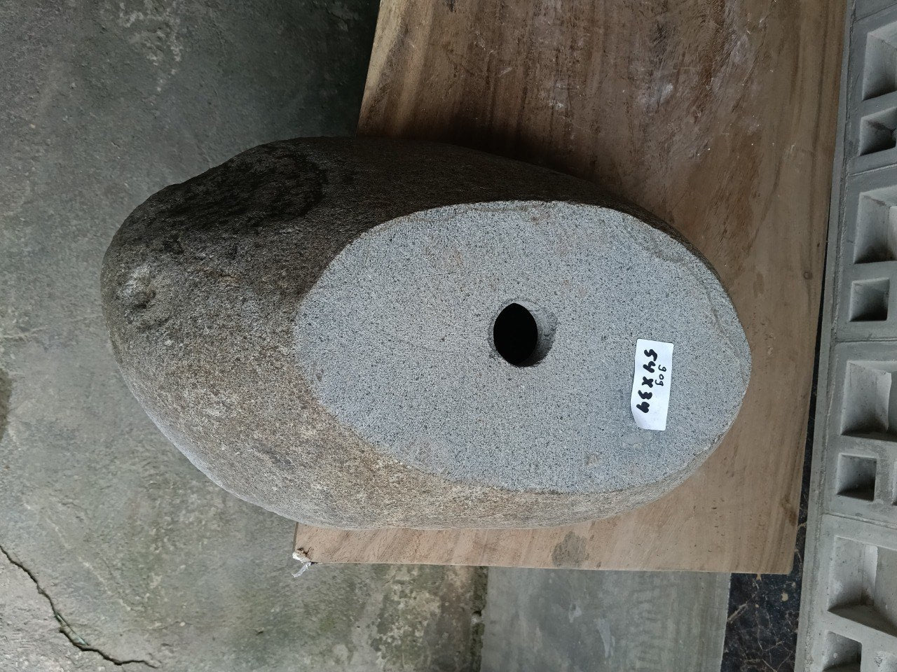 Bottom view of 6909-5434 solid river stone vessel