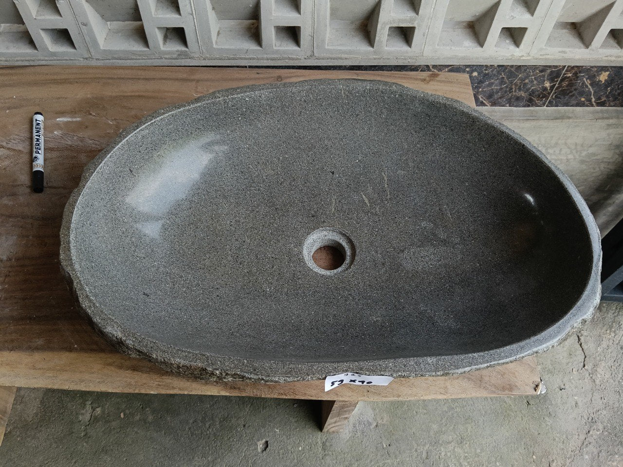 Top view of 6923-5940 graphite gray oval river stone sink — handcrafted natural stone