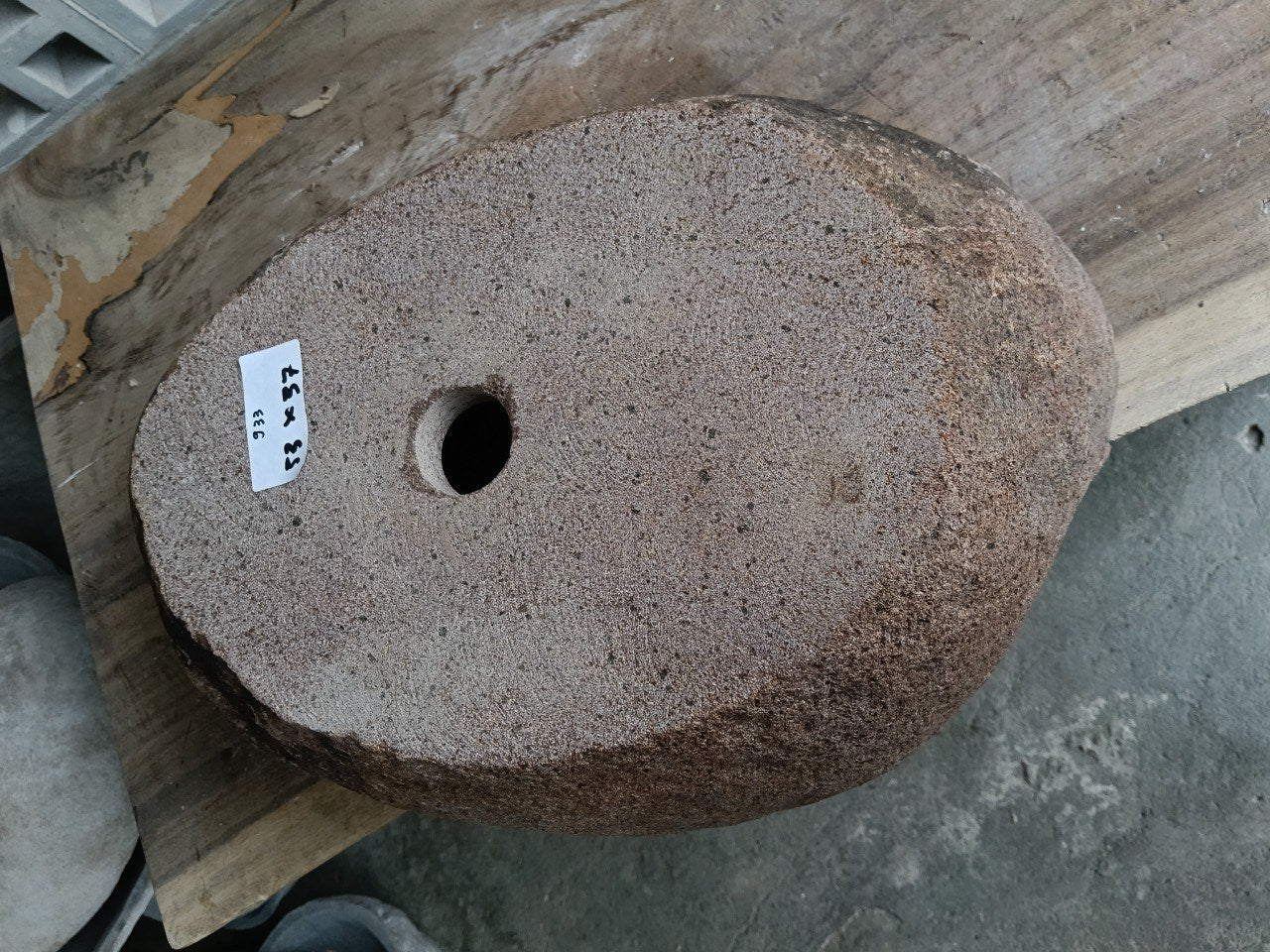 Bottom view of 6933-5337 solid river stone vessel
