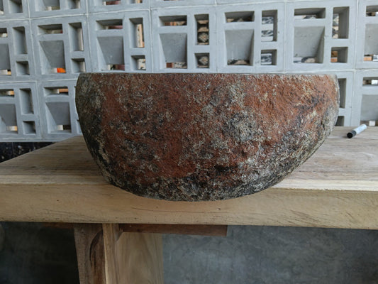 Front view of 6944-5145 river stone basin — polished interior