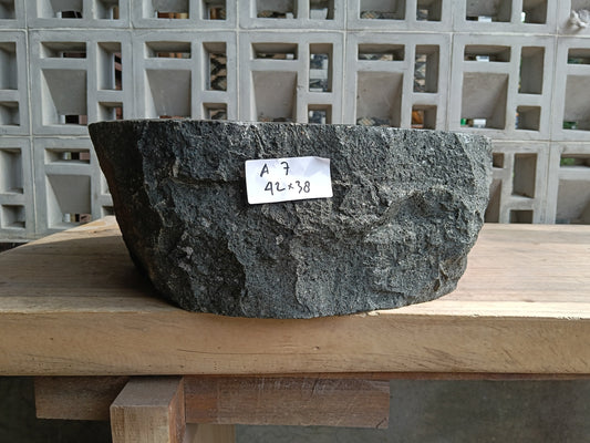 Front view of 60A7-4238 andesite vessel basin — polished oval interior