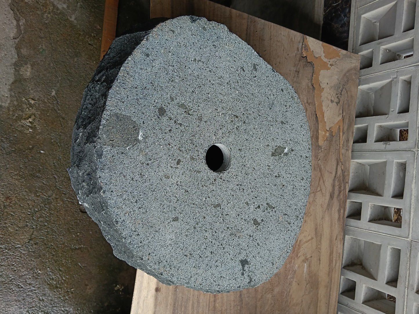 Bottom view of 60A9-5040 solid andesite stone sink — standard drain hole