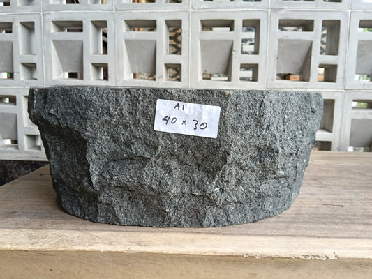 Front view of 60A1-4030 andesite stone basin — polished interior and natural edge