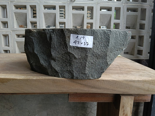 Front view of 6A14-4237 andesite vessel basin — polished interior and natural edge