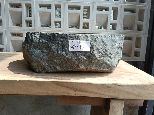 Front view of 6A16-4137 andesite vessel basin — polished oval interior