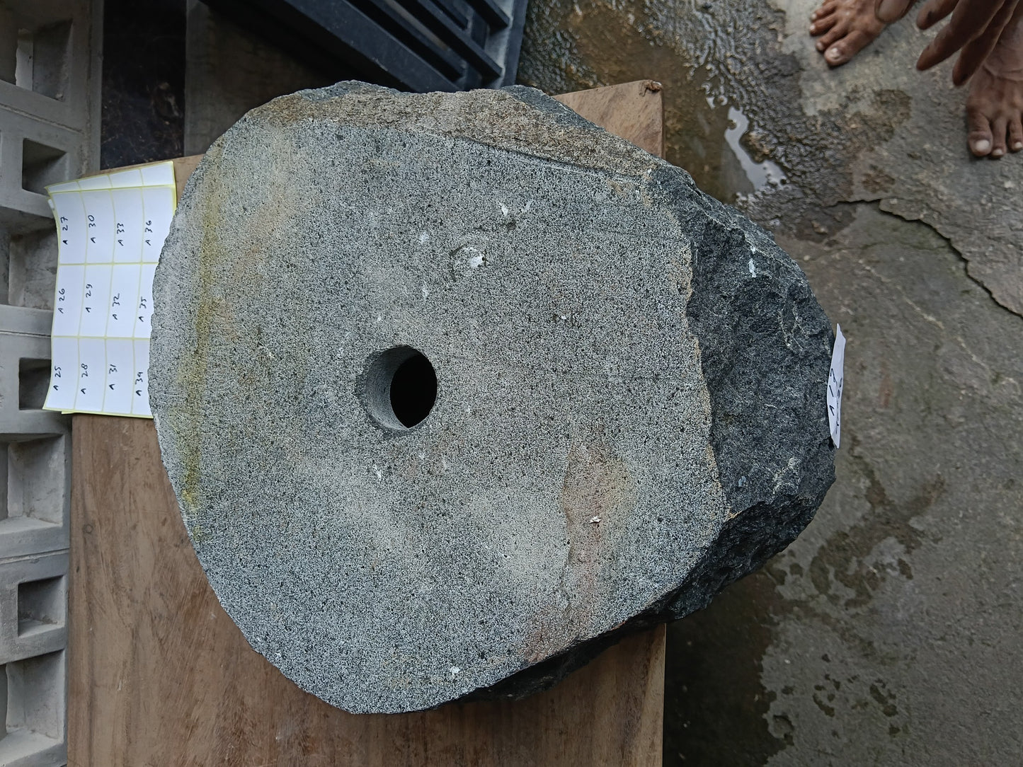 Bottom view of 6A17-4238 solid andesite stone sink — standard drain hole
