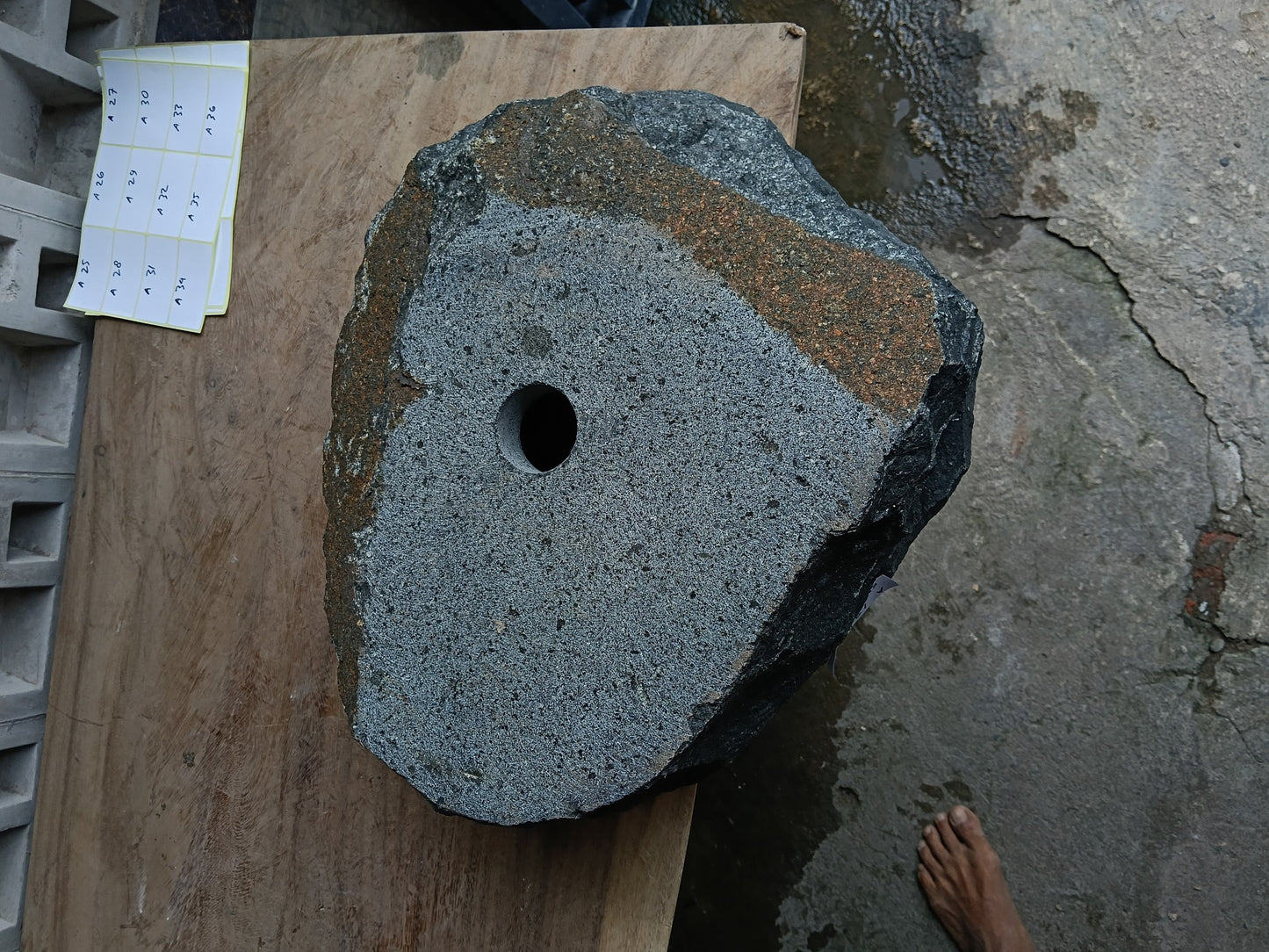 Bottom view of 6A19-4136 solid andesite stone sink — standard drain hole